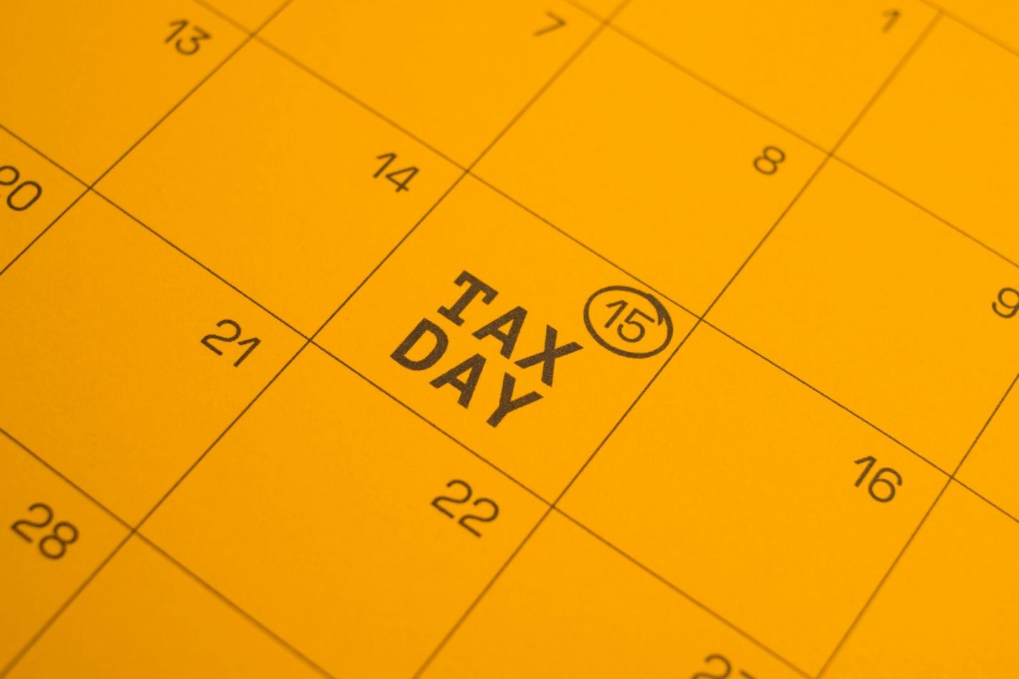 Calendar shows "tax day" circled on the 15th.
